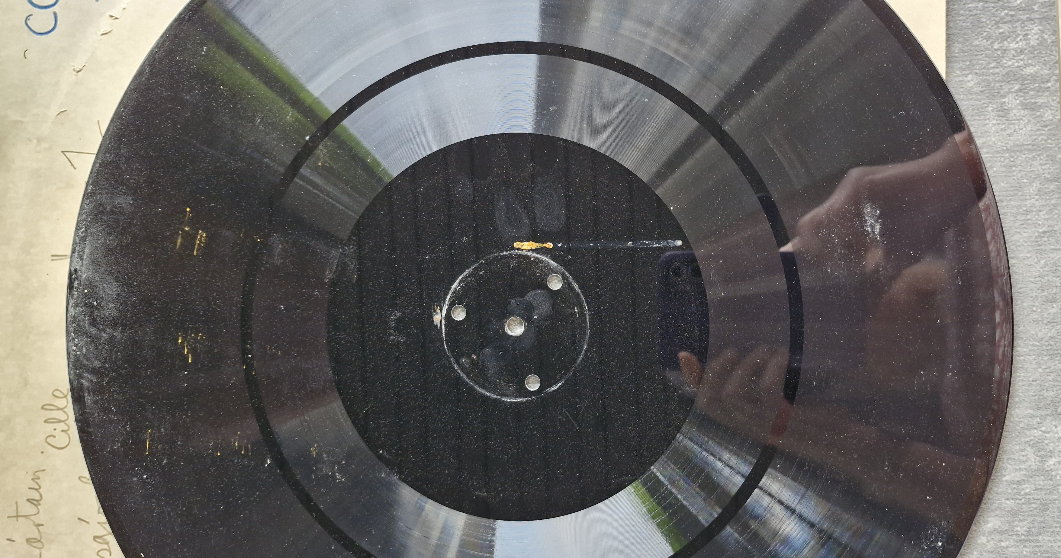 Rust mark, palmitic acid and dirt on an acetate disc